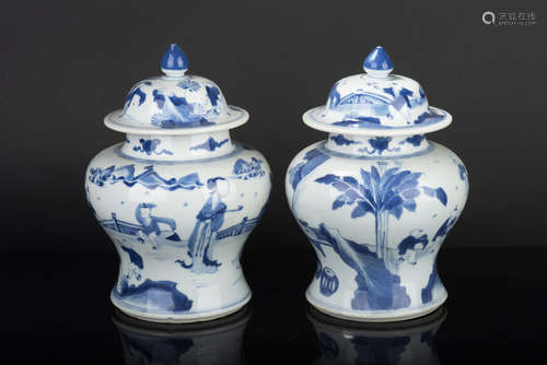 PAIR OF BLUE AND WHITE CHILDREN' VASES WITH COVERS