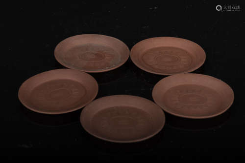 SET OF FIVE YIXING ZISHA CARVED TEA CUP SAUCERS