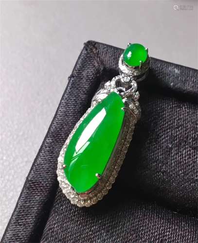 A Chinese Carved Jadeite Necklace Pendant