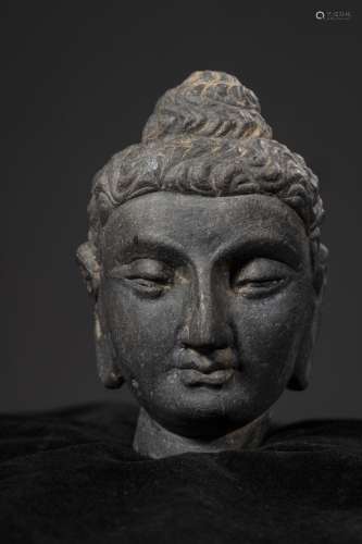 A Chinese Carved Stone Buddha Top