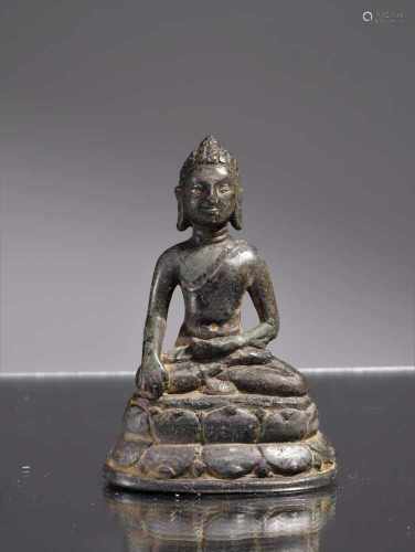 BUDDHABronze and SilverNorth-India 12th centuryDimensions: Height 8 cmWeight: 118 gramsSeated Buddha