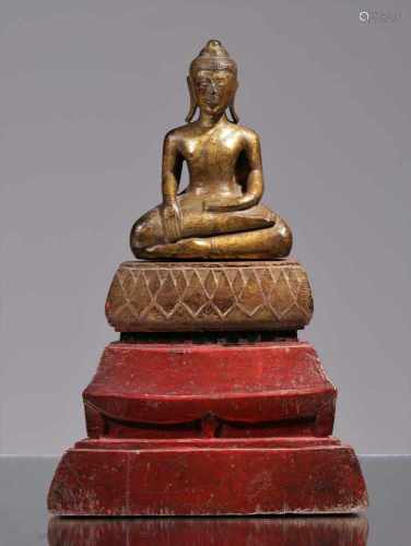 BUDDHA IN EARTH TOUCHING POSITIONWood painted and giltLaos 19th centuryDimensions: Height 22,5 cm