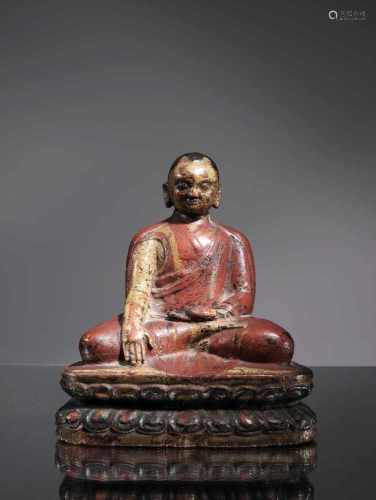 LAMAWood paintedTibet , 16th centuryDimensions: Height 15 cm Weight: 318 gramsLama seated on