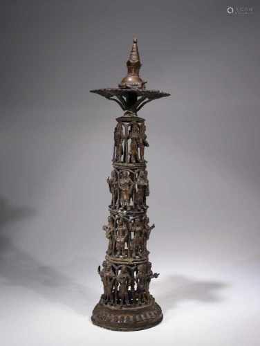 OIL LAMP WITH STUPA AND MUSICIAN BASEBronze,Nepal, 17th century,Dimensions: Height 52 cm , Wide 12
