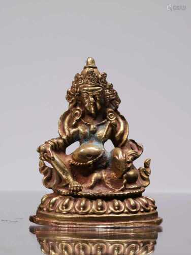 JAMBHALABronze fire gilt,Tibet 19th centuryHeight: 6 cm Wide 4,5 cm Depth 3 cm Weight: 76 gramsThe