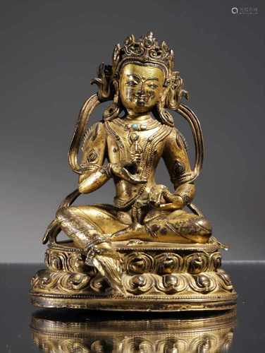 A GILT COPPER ALLOY FIGURE OF VAJRASATTVABronze fire giltTibet , 14th centuryDimensions: Height 9,