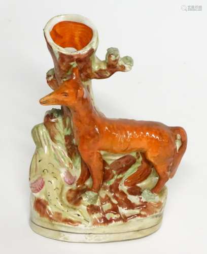 A Staffordshire flat backed fox and game bird spill vase, 8