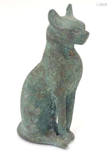 A cast bronze model of a seated cat. Approx.