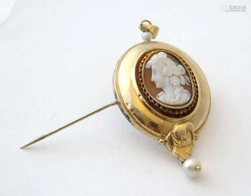 An Italian 8ct gold pendant / brooch set with central carved cameo and with pearl drop.