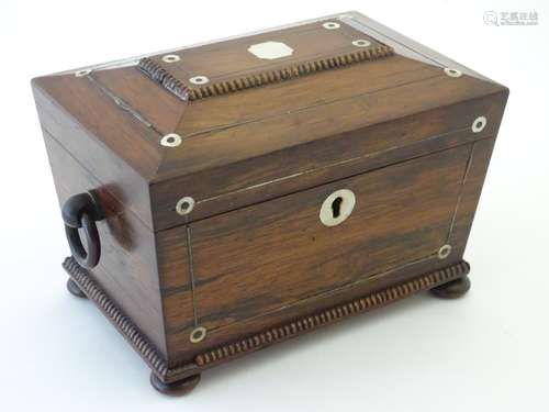 A William IV rosewood sarcophagus shaped two section tea caddy with a fitted interior,