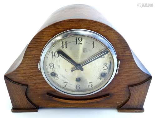 A 1930s-1940s mantel clock, the face stamped 'Made in England', movement with chimes,