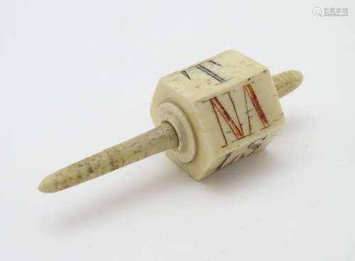 A 19thC bone six sided teetotum / spinning top, marked with the letters NA, LS, ND, SZ, NH, and T.