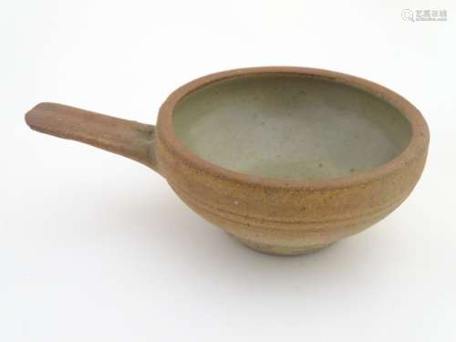 A Leach Pottery, St. Ives, stoneware egg baker / ramekin with a single handle.