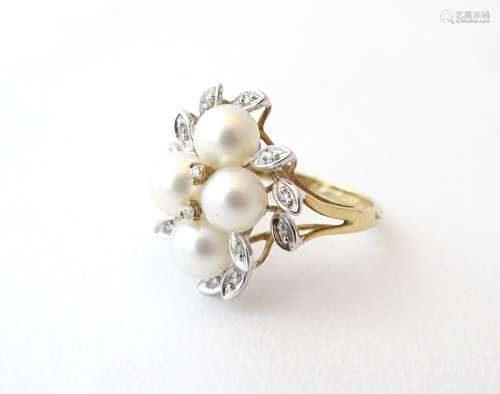 A 9ct gold dress ring set with four pearls and diamonds in a foliate setting. Ring size approx.