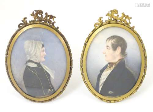 A pair of 19thC cabinet portrait miniatures, in easel back oval frames with scrolling decoration.