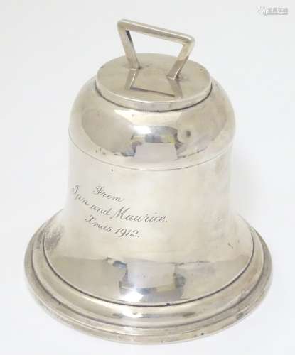 A silver inkwell of bell / capstone form with hinged lid.