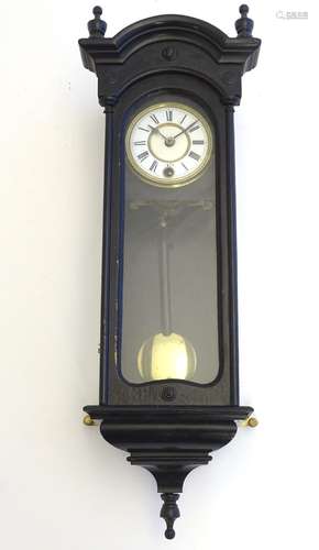 A late 19thC miniature regulator wall clock, ebonised case with glazed door and side panels,