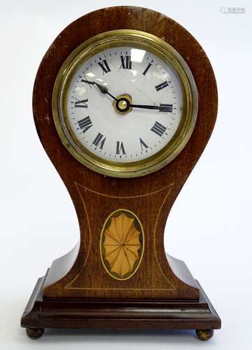 An early to mid 20thC mantel clock, the mahogany balloon case with boxwood inlays,