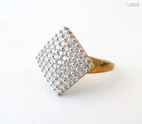 A 9ct gold dress ring with a profusion of pave diamonds. Ring size approx.