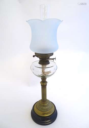 An early 20thC Duplex oil lamp, with opaque glass shade,