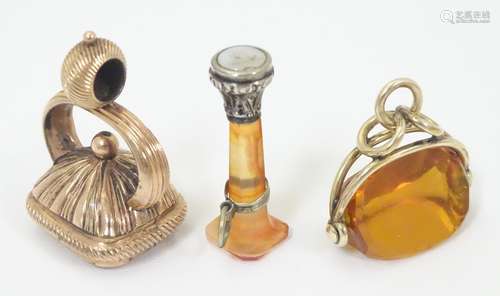 Three various 19thC pendant fob seals including a rotating seal in a gilt metal mount The largest 1