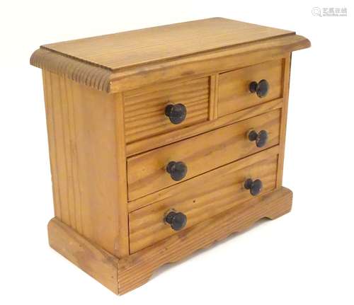 A 19th / 20thC miniature apprentice piece pine chest of drawers. Approx.