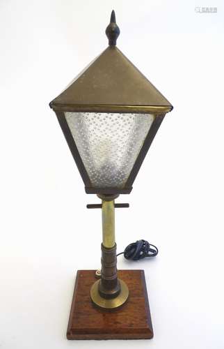 An early to mid 20thC novelty table lamp formed as a street light,