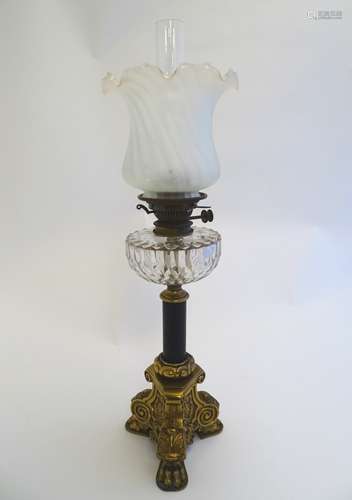 A late Victorian Hinks oil lamp, with opaque glass shade,