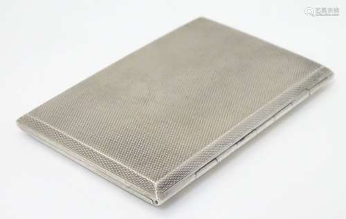 A Continental silver card / cheroot case with engine turned decoration with gilded interior.