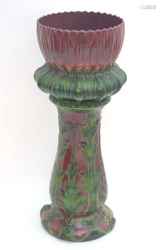 A large Victorian majolica jardiniere on stand of stylised flower form. Approx.