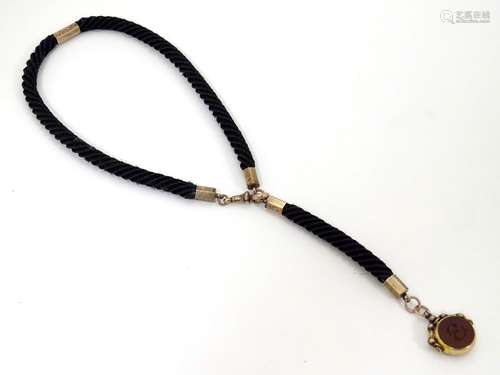 Memorial / Mourning jewellery : A Victorian Albert watch chain, the chain formed from plaited hair,