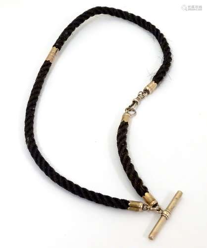 Memorial / Mourning jewellery : A Victorian Albert watch chain, the chain formed from plaited hair,