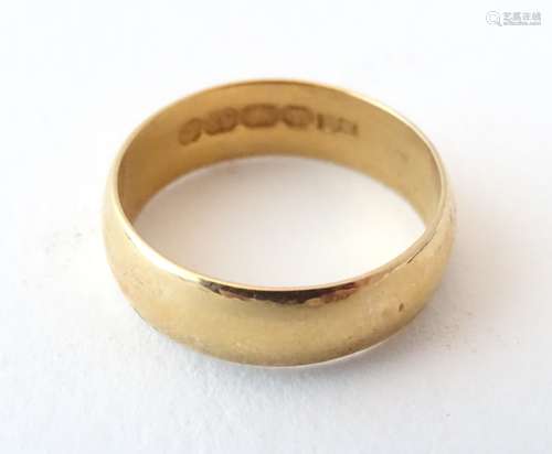 A 22ct gold ring. Ring size approx.