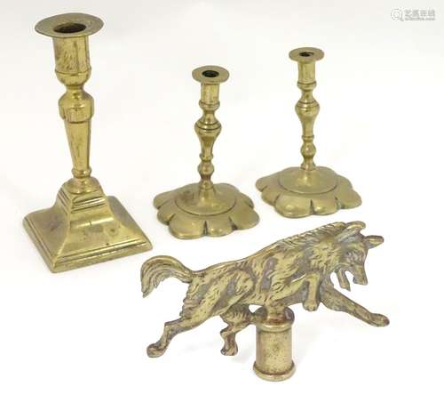 Four assorted 20thC brass items to include a Boy Scout wolf finial / flag topper,