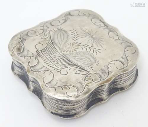 A Continental silver snuff box of squared shaped form with engraved decoration.