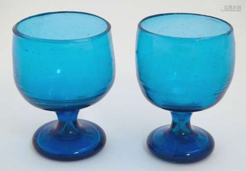 Two 19thC turquoise soda glass pedestal drinking glasses. Approx. 5