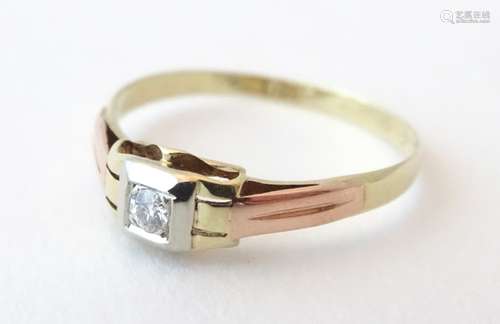 A gold ring set with central diamond in a squared Art Deco setting, the diamond approx. 0.25ct.