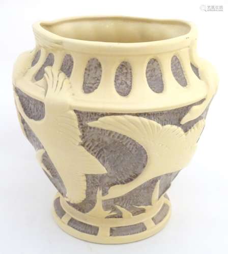A Burleigh ware moulded ceramic vase / jardiniere decorated with birds in flight.