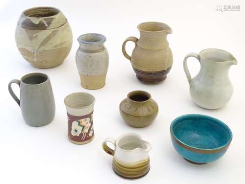 A quantity of assorted studio pottery wares to include jugs, vases and bowls.