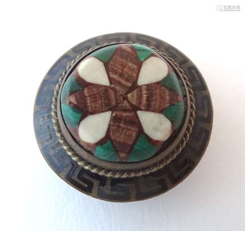 An early 20thC gilt metal stud / brooch with Greek key enamel decoration and inlaid malachite etc