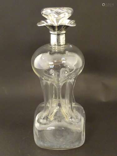 A glass decanter with pinch waist detail and silver rim hallmarked Birmingham 1906 maker 11