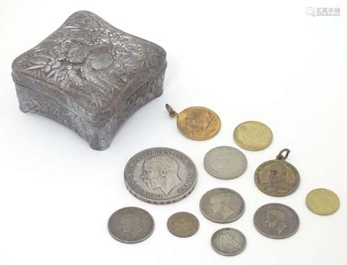 A cast metal box with bamboo and floral decoration containing assorted 19thC and later coins etc.