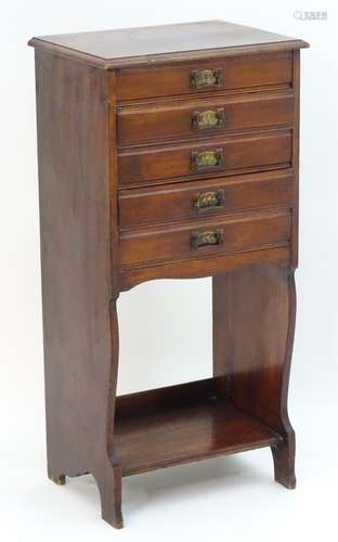 An early / mid 20thC mahogany music cabinet with a rectangular moulded top above five short drawers