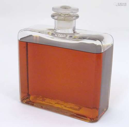 A rectangular glass scent / perfume bottle with canted corners and stopper.