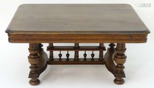 A 20thC oak table with a rectangular moulded top,