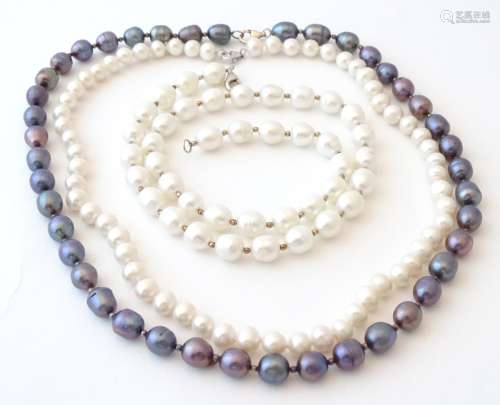 Three various pearl necklaces with silver clasps. The longest approx.