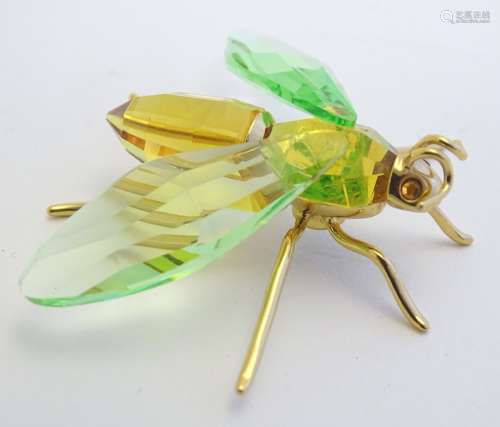 Swarovski crystal a model of a bug / insect from the paradise collection with silver gilt mounts.