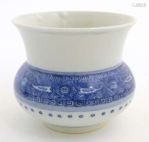 A Chinese pot / vase of squat form with a round body and a flared rim,