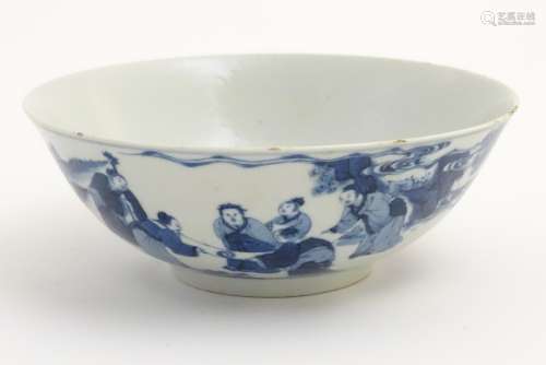 A Chinese blue and white bowl depicting figures in a landscape. Character marks under.
