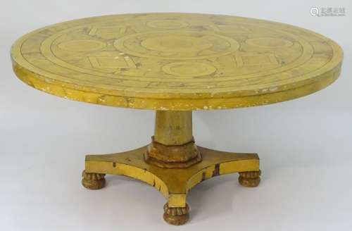 A 20thC dining / breakfast table with a painted circular top above a canted and moulded pedestal